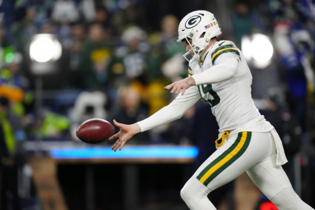 green-bay-packers-punter-daniel-whelan-19-with-a-international-flag-decal-on-his-helmet-punts-the-ball-before-an-nfl-football-game-against-the-seattle-seahawks-sunday-dec-15-2024-in-seattle-the