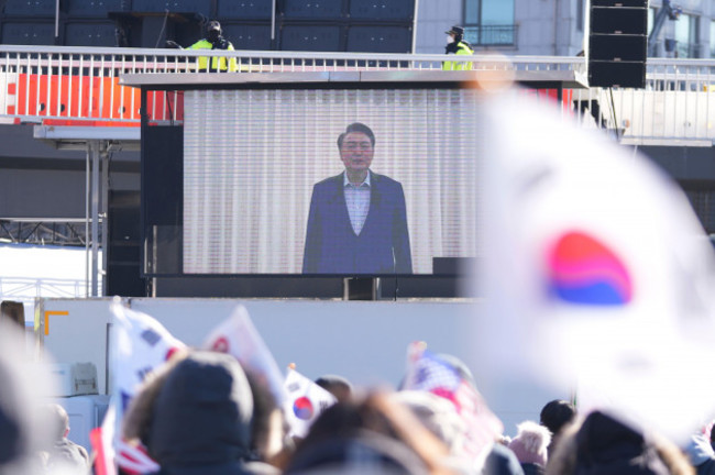 a-huge-screen-shows-a-footage-of-impeached-south-korean-president-yoon-suk-yeol-as-supporters-stage-a-rally-to-oppose-his-impeachment-near-the-presidential-residence-in-seoul-south-korea-wednesday