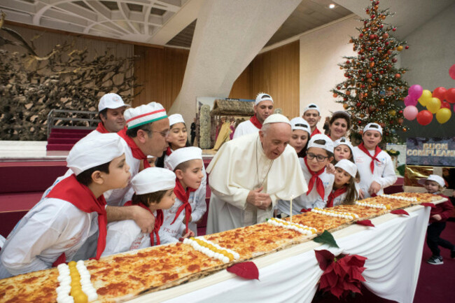 pope-francis-has-blown-out-his-birthday-candle-on-an-extra-long-pizza-at-the-vatican-on-december-17-2017-to-the-delight-of-children-francis-who-turned-81-then-told-the-children-who-use-the-vatican