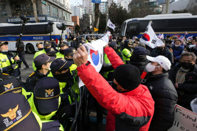supporters-of-impeached-south-korean-president-yoon-suk-yeol-are-blocked-by-police-officers-as-they-try-to-go-to-the-seoul-western-district-court-in-seoul-south-korea-saturday-jan-18-2025-ap-ph