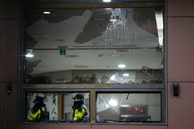 police-officers-patrol-inside-seoul-western-district-court-after-supporters-of-impeached-south-korean-president-yoon-suk-yeol-broke-into-the-court-in-seoul-south-korea-sunday-jan-19-2025-ap-pho