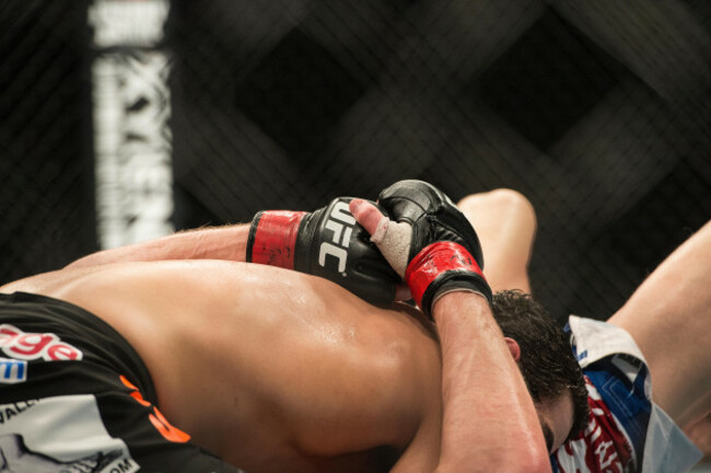 mma-ufc-ultimate-fighting-championship-gloves-during-a-bout-in-the-octagon-at-wembley-arena