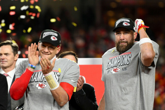 kansas-city-chiefs-quarterback-patrick-mahomes-left-and-chiefs-tight-end-travis-kelce-right-celebrate-on-stage-after-the-nfl-afc-championship-football-game-against-the-buffalo-bills-sunday-jan