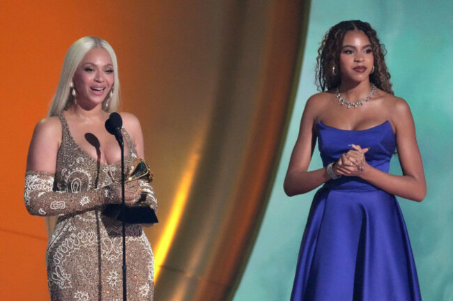 beyonce-accepts-the-award-for-album-of-the-year-for-cowboy-carter-during-the-67th-annual-grammy-awards-on-sunday-feb-2-2025-in-los-angeles-blue-ivy-carter-looks-on-from-right-ap-photochris-piz