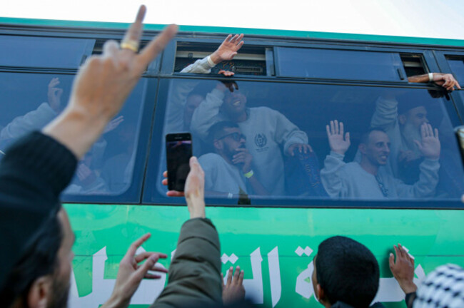 freed-palestinian-prisoners-wave-from-a-bus-as-they-arrive-in-the-gaza-strip-after-being-released-from-an-israeli-prison-following-a-ceasefire-agreement-between-hamas-and-israel-in-khan-younis-saturd
