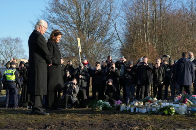 swedens-king-carl-xvi-gustaf-and-queen-silvia-place-flowers-at-a-memorial-near-the-scene-of-a-shooting-on-the-outskirts-of-orebro-sweden-wednesday-feb-5-2025-ap-photosergei-grits