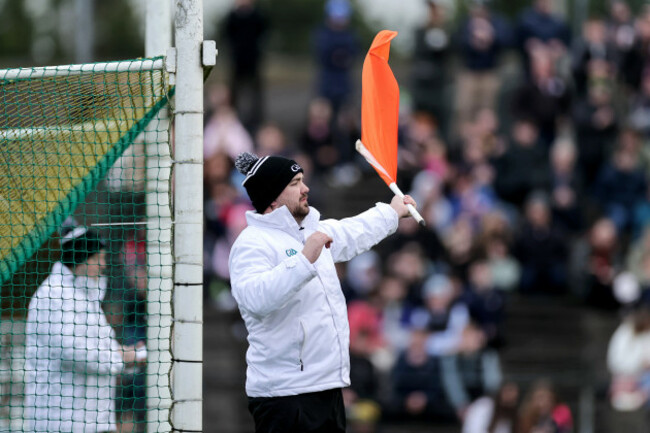 an-umpire-waves-the-orange-flag-during-the-game