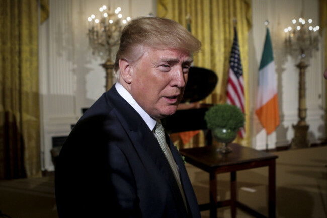 president-donald-trump-greets-guests-as-he-leaves-the-east-room-of-the-white-house-during-the-annual-shamrock-presentation-ceremony-on-march-15-2018-in-washington-dc-photo-by-oliver-contrerassipa