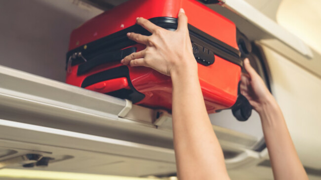 cabincrewliftluggagebaginairplane-airlinetransportation