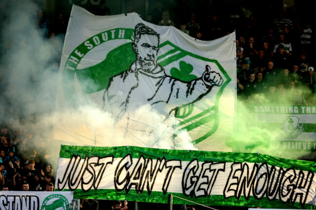 shamrock-rovers-fans-set-off-flares-and-smoke-bombs-in-the-crowd-with-a-banner-of-head-coach-stephen-bradley