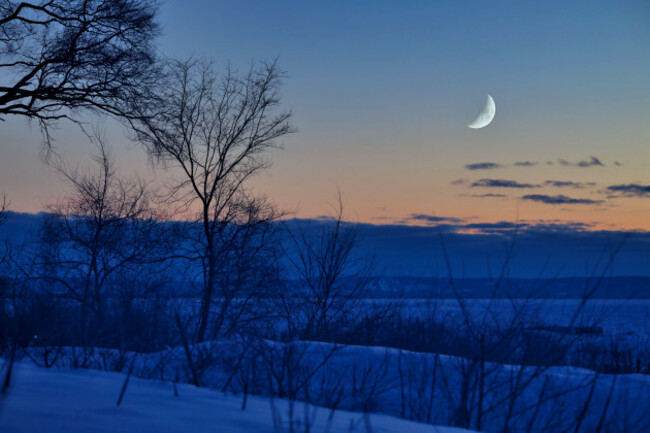 twilight-view-of-georgian-bay-in-winter-with-trees-moon-sunset-and-blue-mountain