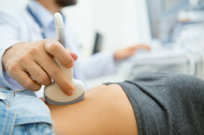 selectivefocusonultrasoundscannerdeviceinthehandof