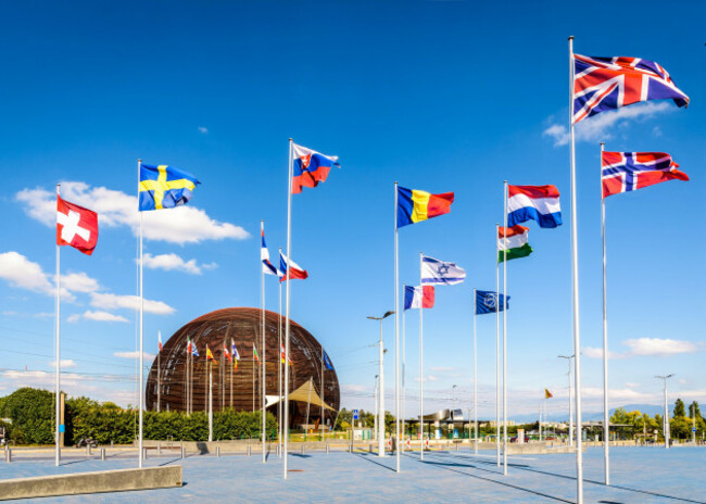 the-globe-of-science-and-innovation-at-cern-the-european-council-for-nuclear-research-near-geneva-with-the-flags-of-the-member-states-flying