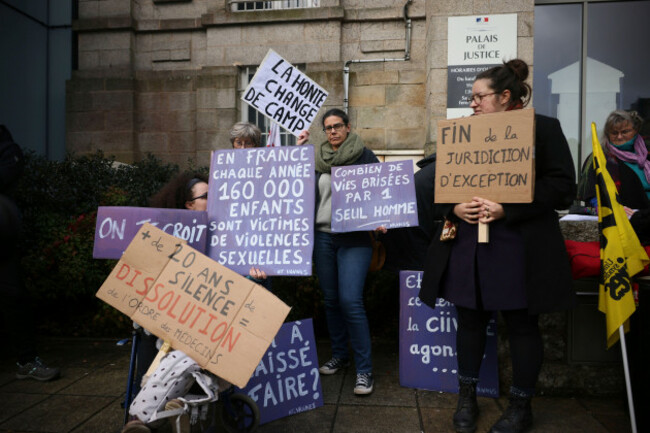 a-protestor-holds-a-banner-reads-shame-changes-side-during-a-protest-outside-the-vannes-courthouse-western-france-on-the-opening-day-of-the-trial-of-french-surgeon-joel-le-scouarnec-accused-of-r