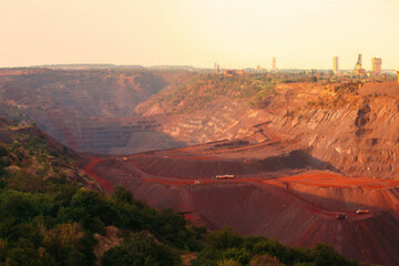 bulldozers-and-trucks-in-quarry-with-red-ground-mining-iron-ore-in-kriviy-rih-ukraine-industrial-landscape