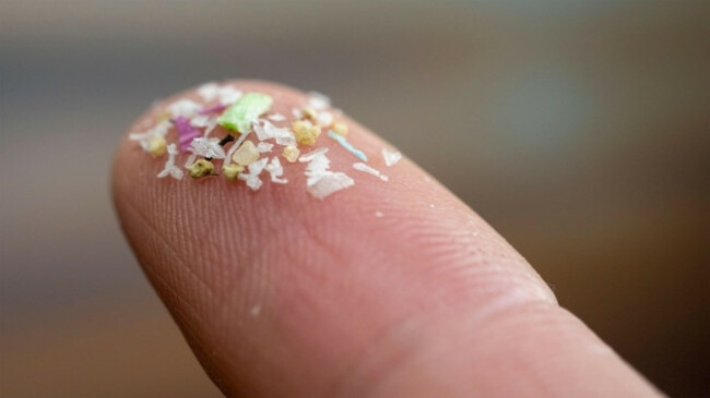 close-up-side-shot-of-microplastics-on-human-fingers-concept-for-water-pollution-and-global-warming-climate-change-idea