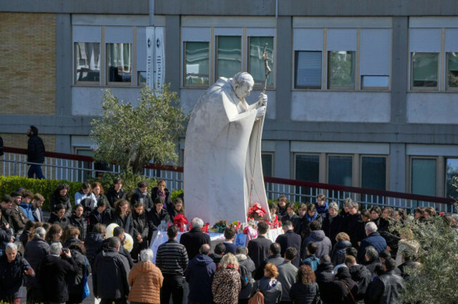 faithful-gather-in-prayer-around-the-statue-of-john-paul-ii-outside-the-agostino-gemelli-polyclinic-where-pope-francis-is-hospitalized-in-rome-sunday-march-2-2025-ap-photogregorio-borgia