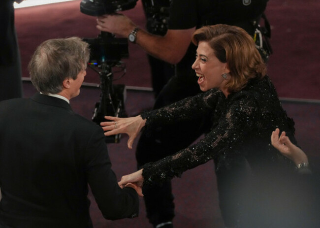 fernanda-torres-right-congratulates-walter-salles-after-he-wins-the-award-for-im-still-here-from-brazil-for-best-international-feature-film-during-the-oscars-on-sunday-march-2-2025-at-the-dol