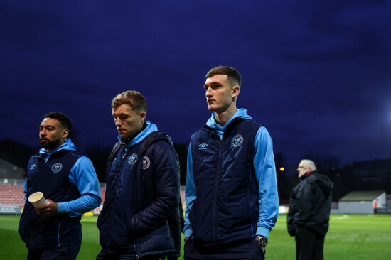 jake-mulraney-jamie-lennon-and-mason-melia-walk-in-after-inspecting-the-pitch