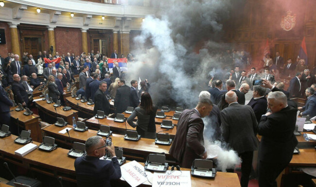 in-this-grab-taken-from-video-provided-by-rts-serbia-smoke-bombs-and-flares-are-released-in-parliament-in-belgrade-serbia-tuesday-march-4-2025-rts-serbia-via-ap
