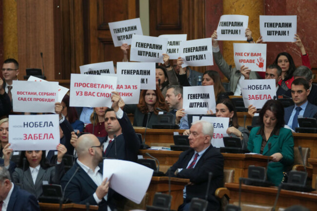 opposition-lawmakers-hold-banners-reading-general-strike-during-a-parliament-session-in-belgrade-serbia-tuesday-march-4-2025-ap-photodarko-vojinovic