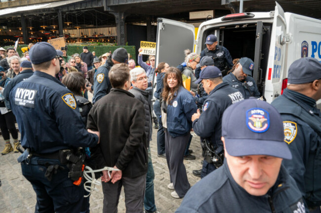 new-york-usa-1st-mar-2025-some-protesters-were-arrested-after-occupying-the-lobby-entrance-protesters-filled-the-street-outside-tesla-showroom-in-downtown-manhattan-to-denounce-elon-musks-action