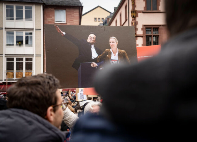15-february-2025-hesse-frankfurtmain-thousands-of-people-demonstrate-on-frankfurts-romerberg-under-the-slogan-vote-for-love-including-a-poster-showing-elon-musk-and-alice-weidel-the-rally-is