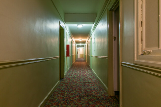 long-dark-and-creepy-hallway-in-an-old-american-apartment-building