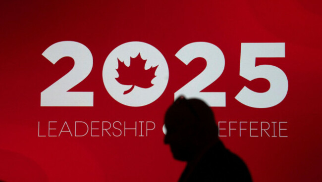 a-man-waits-for-the-main-doors-to-be-opened-ahead-of-a-liberal-leadership-announcement-on-sunday-march-9-2025-in-ottawa-adrian-wyldthe-canadian-press-via-ap