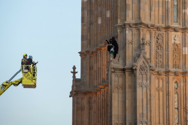 london-england-uk-8th-mar-2025-a-man-holding-a-palestinian-flag-climbed-the-elizabeth-tower-home-to-big-ben-at-the-palace-of-westminster-in-london-emergency-services-including-police-fire-a