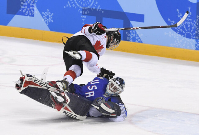 february-22-2018-pyeongchang-south-korea-melodie-daoust-of-canada-collides-with-us-goalie-maddie-rooney-after-scoring-on-an-overtime-penalty-shootout-during-the-womens-gold-medal-ice-hockey-gam