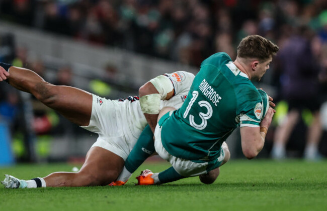 irelands-garry-ringrose-is-tackled-by-englands-ollie-lawrence
