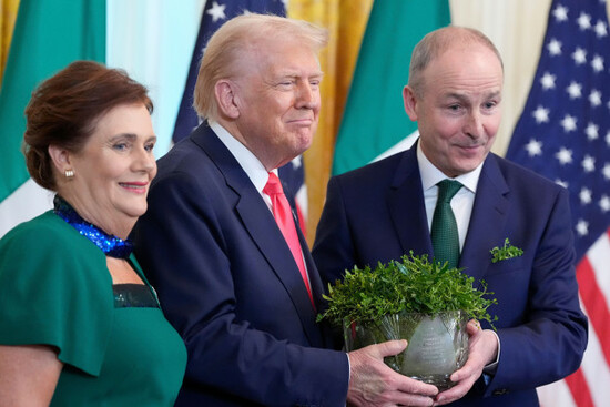 irelands-prime-minister-micheal-martin-and-his-wife-mary-oshea-pose-with-president-donald-trump-as-they-hold-a-bowl-of-shamrocks-during-an-event-in-the-east-room-of-the-white-house-in-washington-we