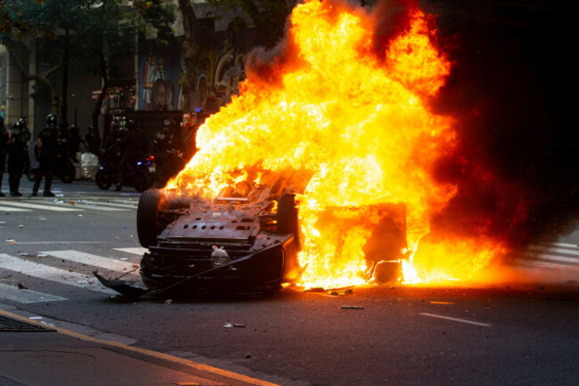 buenos-aires-argentina-12th-mar-2025-a-police-vehicle-completely-engulfed-in-flames-near-the-congress-during-the-rally-retirees-protested-at-the-national-congress-demanding-dignified-living-condi