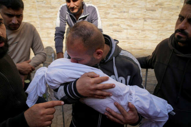 a-palestinian-man-holds-the-body-of-his-11-month-old-nephew-mohammad-shaban-killed-in-an-israeli-army-airstrikes-at-the-al-ahli-hospital-in-gaza-city-tuesday-march-18-2025-ap-photoabdel-kareem