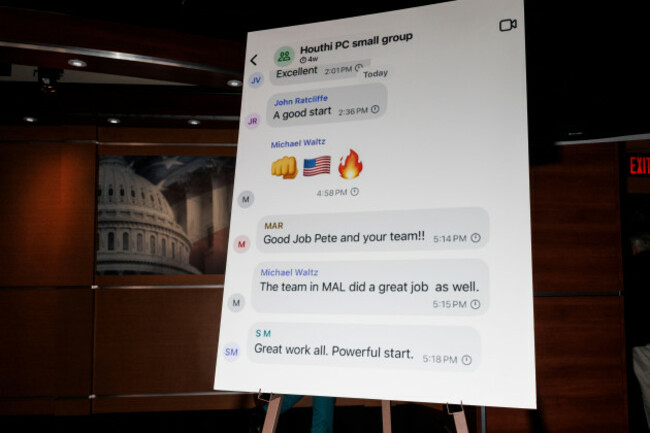 a-poster-of-the-signal-group-chat-of-trump-administration-officials-discussing-an-upcoming-strike-against-houthi-positions-is-seen-during-a-house-democratic-press-conference-in-the-capitol-building-in