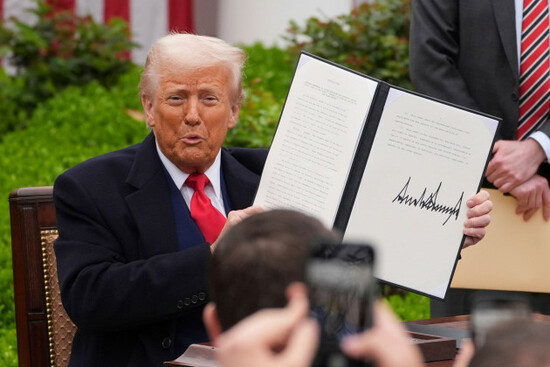 president-donald-trump-holds-a-signed-executive-order-during-an-event-to-announce-new-tariffs-in-the-rose-garden-of-the-white-house-wednesday-april-2-2025-in-washington-ap-photoevan-vucci