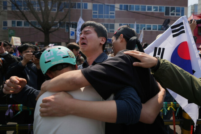 people-react-after-hearing-the-news-that-president-yoon-suk-yeol-was-removed-from-office-in-seoul-south-korea-friday-april-4-2025-ap-photolee-jin-man
