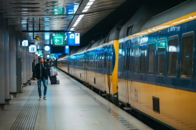 a-regional-sprinter-train-boards-at-schiphol-airport-station-amsterdam-netherlands