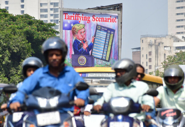 mumbai-india-april-8-an-advertisement-hoarding-by-amul-displays-cartoon-on-us-president-donald-trumps-tariffs-at-byculla-on-april-8-2025-in-mumbai-india-amul-is-known-for-its-topical-and-humoro