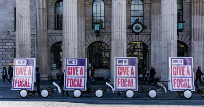 outside-the-general-post-office-in-oconnell-street-dublin-ireland-posters-encouraging-greater-use-of-the-irish-language-give-a-focalword