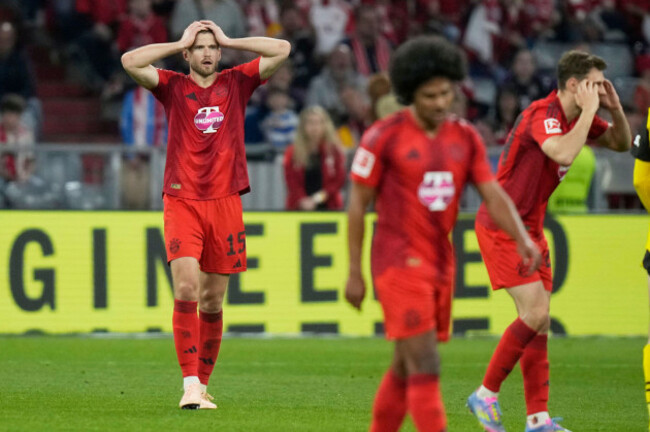 bayerns-eric-dier-left-reacts-after-the-german-bundesliga-soccer-match-between-bayern-munich-and-borussia-dortmund-at-the-allianz-arena-in-munich-germany-saturday-april-12-2025-ap-photomatth