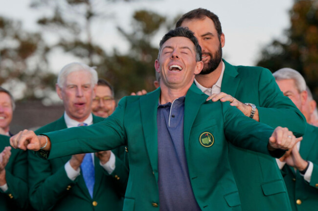 scottie-scheffler-puts-the-green-jacket-on-winner-rory-mcilroy-of-northern-ireland-at-the-masters-golf-tournament-sunday-april-13-2025-in-augusta-ga-ap-photodavid-j-phillip