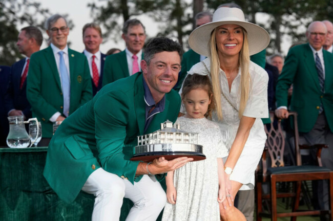 rory-mcilroy-of-northern-ireland-with-his-wife-erica-stoll-and-daughter-poppy-holds-the-trophy-after-winning-the-masters-golf-tournament-sunday-april-13-2025-in-augusta-ga-ap-photodavid-j