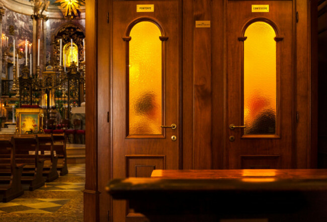 confession-priest-hearing-confession-in-confessional-box-booth-in-roman-catholic-church-sanctuary-of-the-madonna-di-san-luca-in-bologna