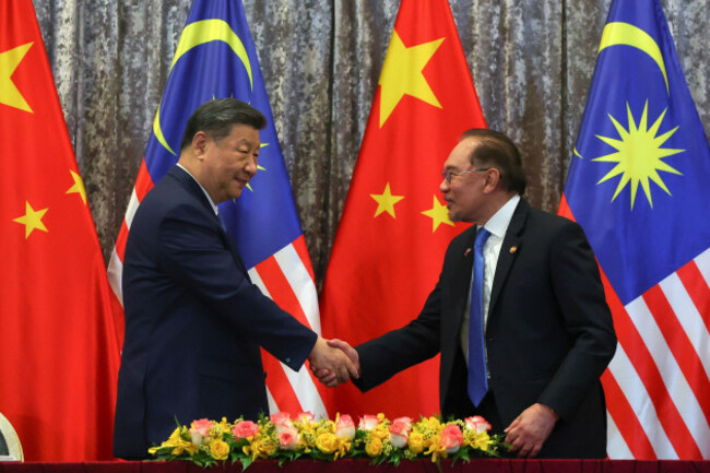chinese-president-xi-jinping-left-and-malaysian-prime-minister-anwar-ibrahim-shake-hand-after-witnessing-exchange-of-agreement-session-between-the-two-countries-at-the-official-residence-of-the-prim