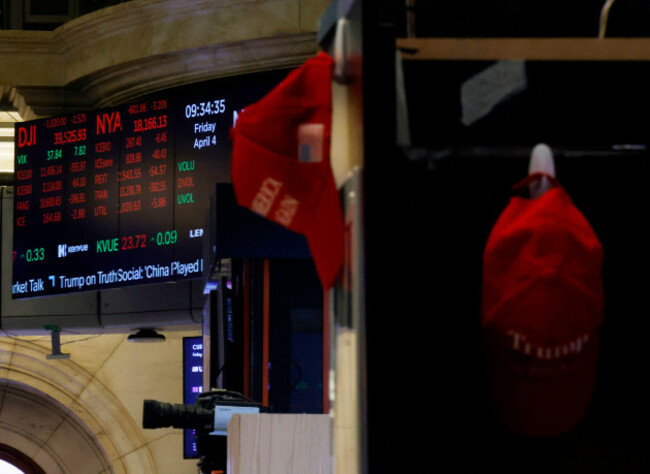 new-york-united-states-04th-apr-2025-trump-maga-merchandise-is-displayed-on-the-floor-of-the-new-york-stock-exchange-as-traders-work-on-wall-street-on-friday-april-4-2025-in-new-york-city-the-d