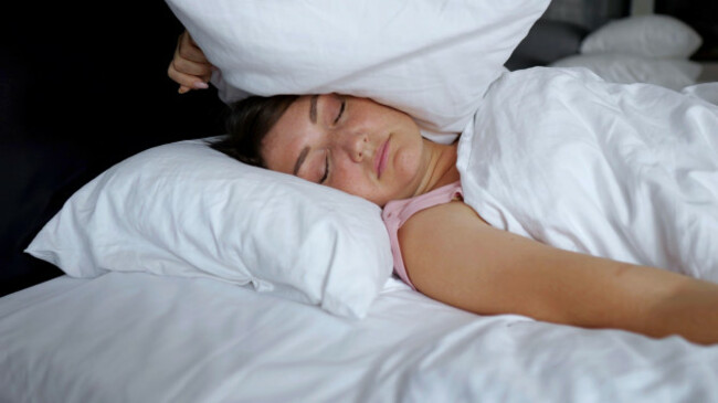 irritated-woman-lies-in-bed-suffering-from-insomnia