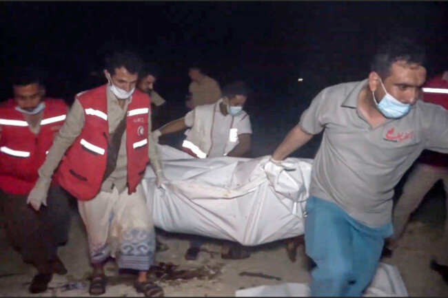 this-photo-taken-from-video-released-by-al-masirah-tv-channel-shows-medics-carrying-a-dead-person-after-u-s-airstrikes-targeted-the-ras-isa-oil-port-held-by-yemens-houthi-rebels-in-hodeida-yemen-f