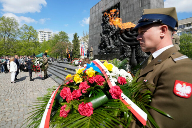a-polish-soldier-lays-a-wreath-at-the-monument-to-the-ghetto-heroes-on-the-82nd-anniversary-of-the-start-of-the-warsaw-ghetto-uprising-against-nazi-german-forces-in-warsaw-poland-on-saturday-april